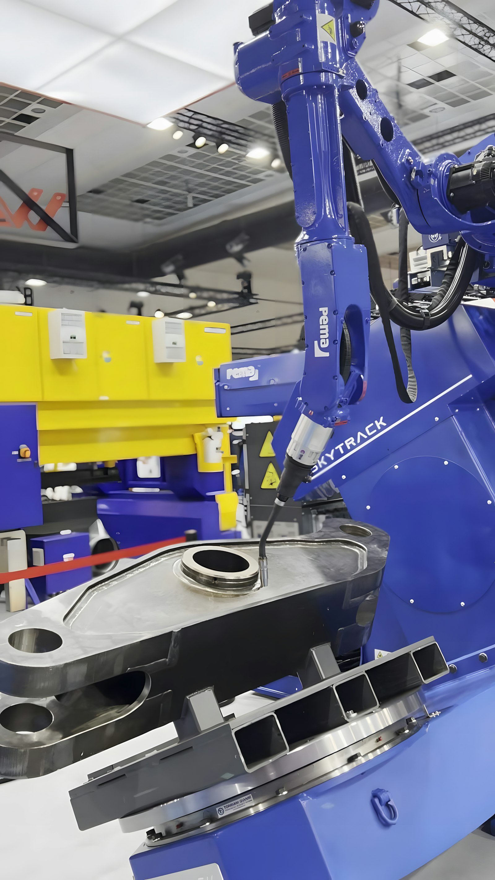 Robot arm working on a metal piece